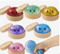 Crystal steamer bun squishy dumpling toys in multiple colors with smiley faces